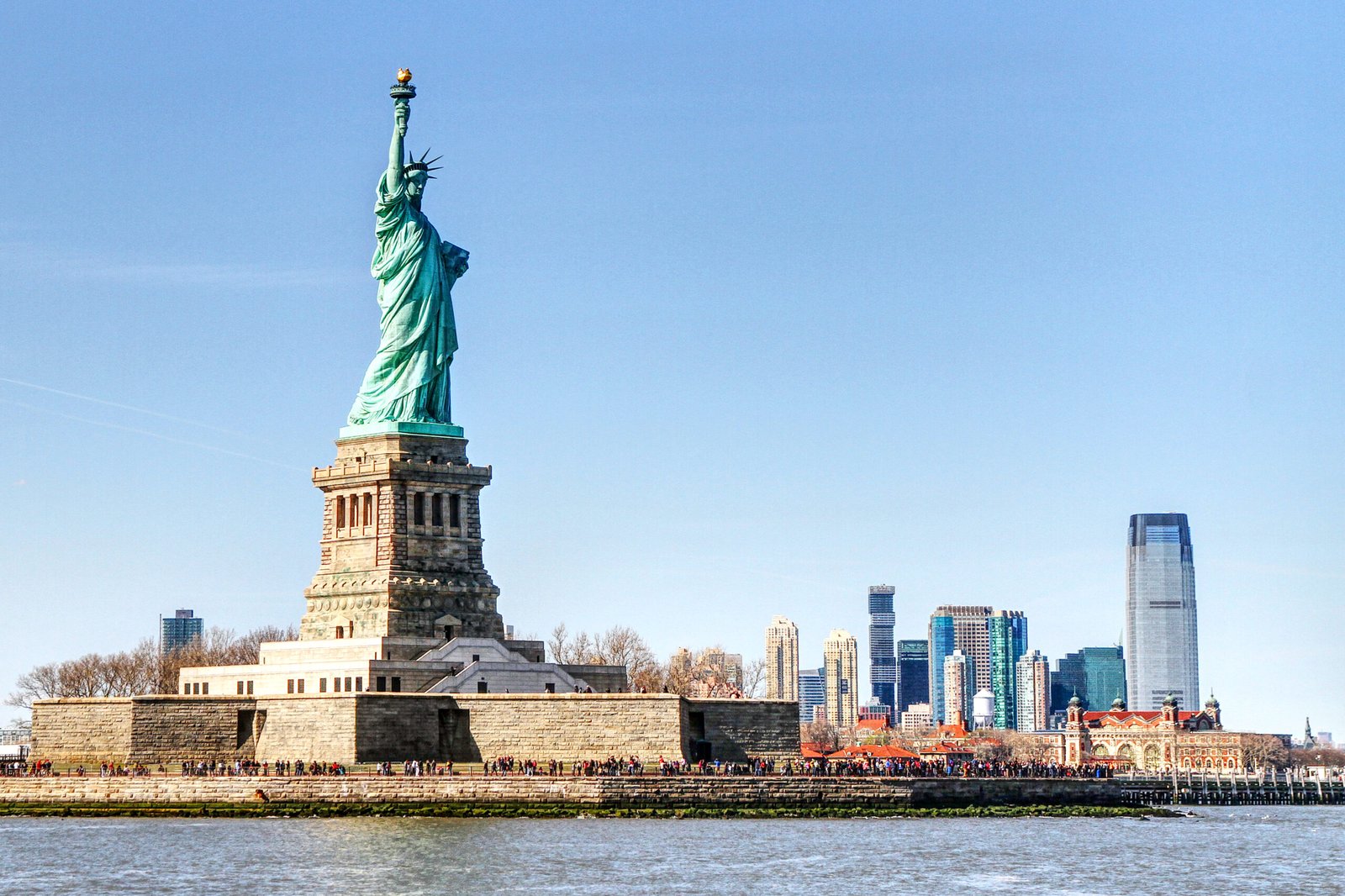 statue liberty with city background